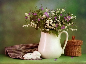 figure, tea-towel, jug, basket, lilies